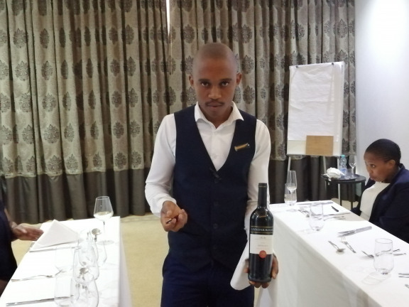 waiter serving wine