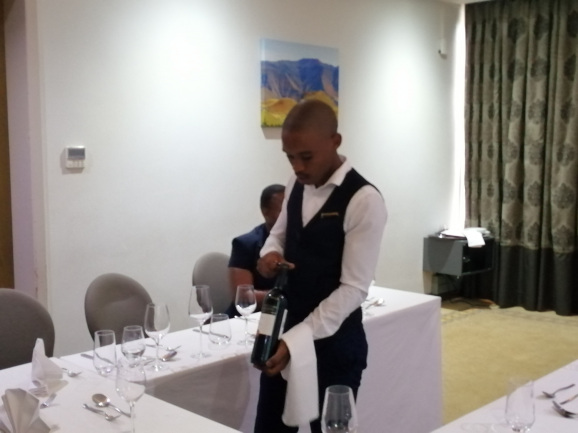 waiter serving wine