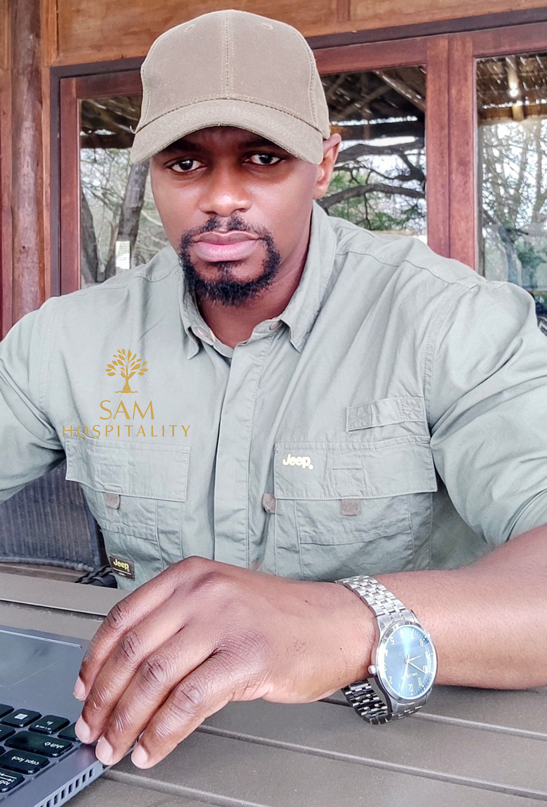 samkeliso nkwanyane wearing blue safari shirt and brown cap
