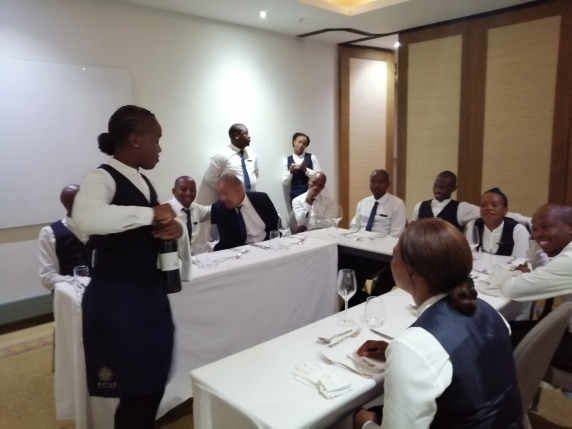 waitress serving wine